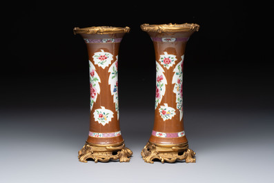 A pair of gilt-bronze-mounted Chinese famille rose capucine-ground vases and a covered bowl, Qianlong