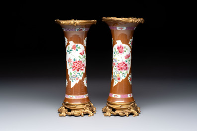 A pair of gilt-bronze-mounted Chinese famille rose capucine-ground vases and a covered bowl, Qianlong