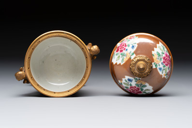 A pair of gilt-bronze-mounted Chinese famille rose capucine-ground vases and a covered bowl, Qianlong