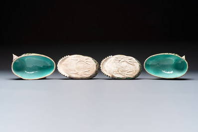 A pair of Chinese turquoise-glazed ducks and a pair of verte biscuit quail-form covered boxes, 20th C.