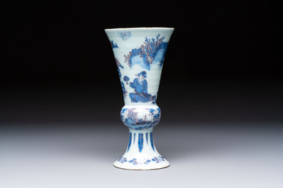 An extremely rare blue, white and manganese Dutch Delft chinoiserie beaker vase after a silver model, late 17th C.