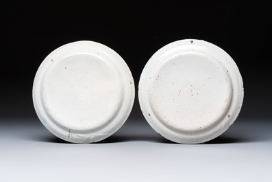 A pair of blue and white Delftware 'Proverb' plates, Germany, dated 1720