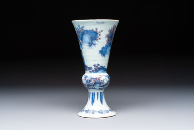 An extremely rare blue, white and manganese Dutch Delft chinoiserie beaker vase after a silver model, late 17th C.