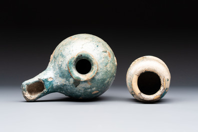 A small turquoise-glazed albarello and three oil lamps, Iran or Syria, 12/13th C.
