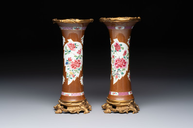 A pair of gilt-bronze-mounted Chinese famille rose capucine-ground vases and a covered bowl, Qianlong