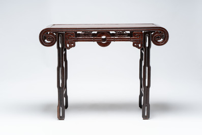 A Chinese elmwood console table, 19th C.