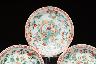 Four Chinese famille verte cups and seven saucers, 19th C.
