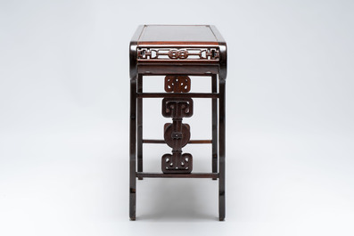 A Chinese elmwood console table, 19th C.
