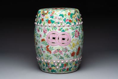 A Chinese famille rose garden seat with butterflies, flowers and fruiting branches, 19th C.