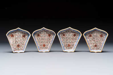 A Chinese famille rose nine-piece 'Plum Blossoms' sweetmeat set on a wooden tray, 19th C.