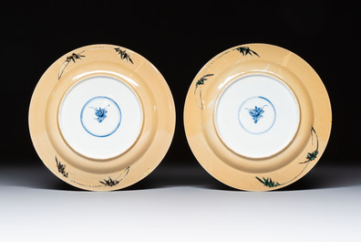 A pair of Chinese famille verte caf&eacute;-au-lait-ground plates with floral design, lotus mark, Kangxi