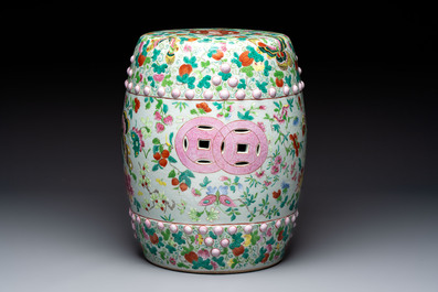 A Chinese famille rose garden seat with butterflies, flowers and fruiting branches, 19th C.