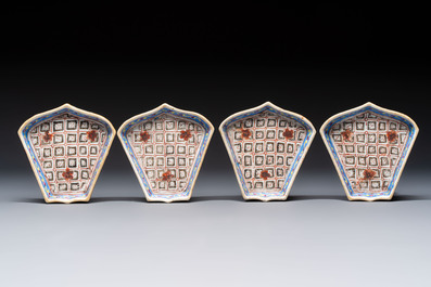 A Chinese famille rose nine-piece 'Plum Blossoms' sweetmeat set on a wooden tray, 19th C.