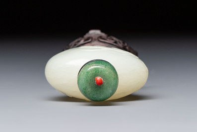A Chinese carved white jade 'Geese' snuff bottle with a wooden stand, 18/19th C.