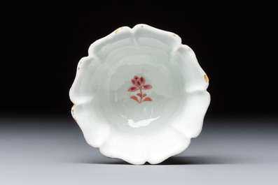 A rare Chinese famille rose moulded cup and saucer with floral design, Yongzheng