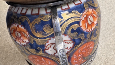 Two Japanese Imari covered bowls, one mounted in silver and wood and the other with gilt-bronze mounts, Meiji, 19th C.