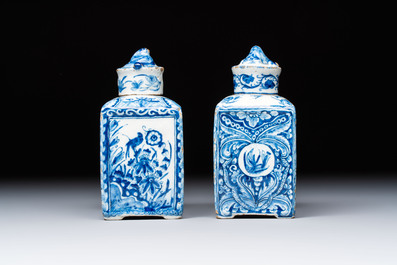 A pair of blue and white Dutch Delft square tea caddies and covers, 18th C.