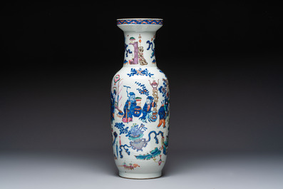 A Chinese doucai and famille rose rouleau vase with figures among antiquities, 19th C.