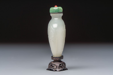 A Chinese carved white jade 'Geese' snuff bottle with a wooden stand, 18/19th C.
