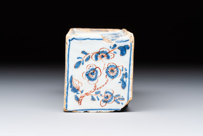 A blue, white and iron-red decorated English Delftware flower brick vase, 18th C.