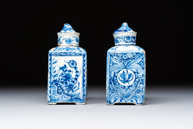 A pair of blue and white Dutch Delft square tea caddies and covers, 18th C.