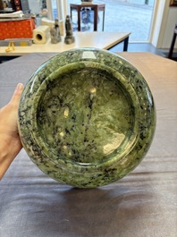 A large Chinese mottled-green serpentine bowl, 20th C.