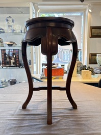 A Chinese hardwood stand with a mounted famille rose plaque, Republic