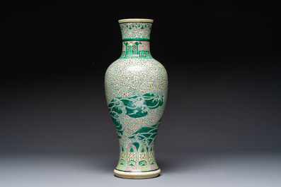 A Chinese verte biscuit 'Dragon Gate Carp 鯉躍龍門' vase on a wooden stand, Xuande mark, 19th C.