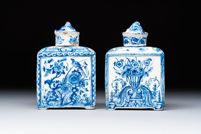 A pair of blue and white Dutch Delft square tea caddies and covers, 18th C.