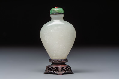 A Chinese carved white jade 'Geese' snuff bottle with a wooden stand, 18/19th C.