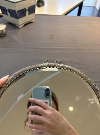 A Chinese silver-plated oval mirror, 19/20th C.