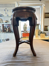 A Chinese hardwood stand with a mounted famille rose plaque, Republic