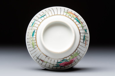 A Chinese famille rose cup and saucer with floral design, Yongzheng