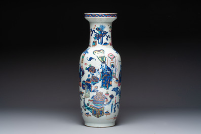 A Chinese doucai and famille rose rouleau vase with figures among antiquities, 19th C.