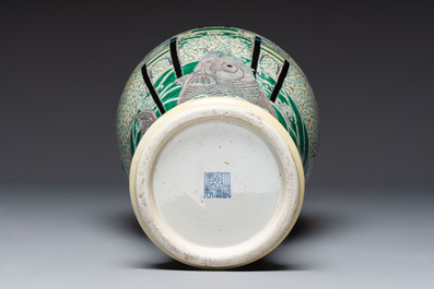 A Chinese verte biscuit 'Dragon Gate Carp 鯉躍龍門' vase on a wooden stand, Xuande mark, 19th C.