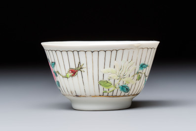 A Chinese famille rose cup and saucer with floral design, Yongzheng