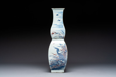 A Chinese blue, white and copper-red 'Birds among Flowering Branches' square gourd vase, 19th C.