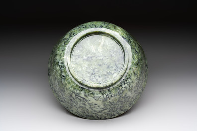 A large Chinese mottled-green serpentine bowl, 20th C.