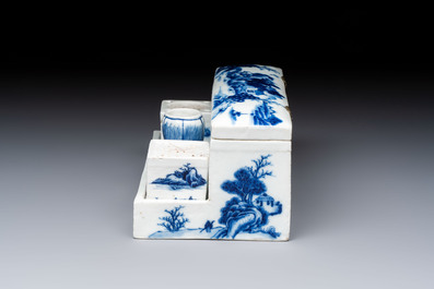A rare Chinese blue and white 'Mountainous Landscape' writing set with an inkwell, sander and candlestick, Qianlong