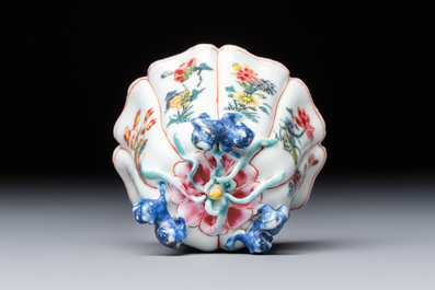A rare Chinese famille rose moulded cup and saucer with floral design, Yongzheng