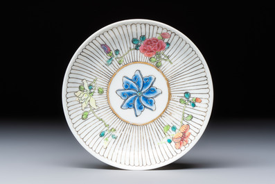 A Chinese famille rose cup and saucer with floral design, Yongzheng
