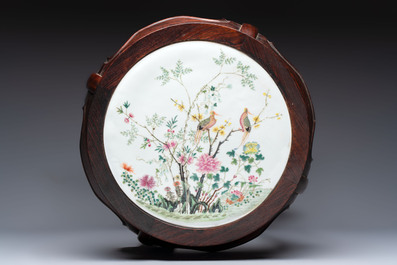 A Chinese hardwood stand with a mounted famille rose plaque, Republic