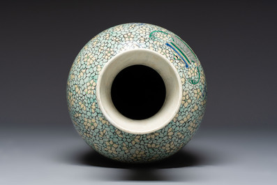 A Chinese verte biscuit 'Dragon Gate Carp 鯉躍龍門' vase on a wooden stand, Xuande mark, 19th C.