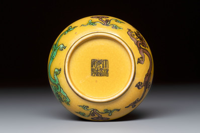 A small Chinese yellow-ground aubergine and green enamelled dragon plate, Qianlong mark, 19/20th C.