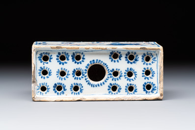 A blue, white and iron-red decorated English Delftware flower brick vase, 18th C.