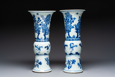 A pair of large Chinese blue and white 'Gu' vases with elegant ladies and playing boys, Kangxi