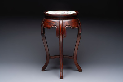 A Chinese hardwood stand with a mounted famille rose plaque, Republic