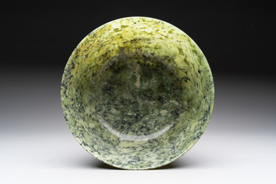 A large Chinese mottled-green serpentine bowl, 20th C.