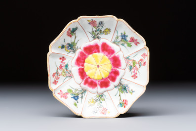 A rare Chinese famille rose moulded cup and saucer with floral design, Yongzheng