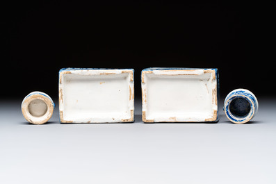 A pair of blue and white Dutch Delft square tea caddies and covers, 18th C.